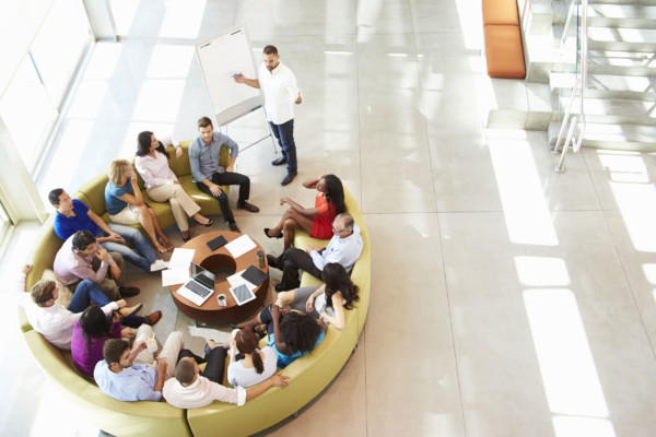 Businessman making presentation to office colleagues